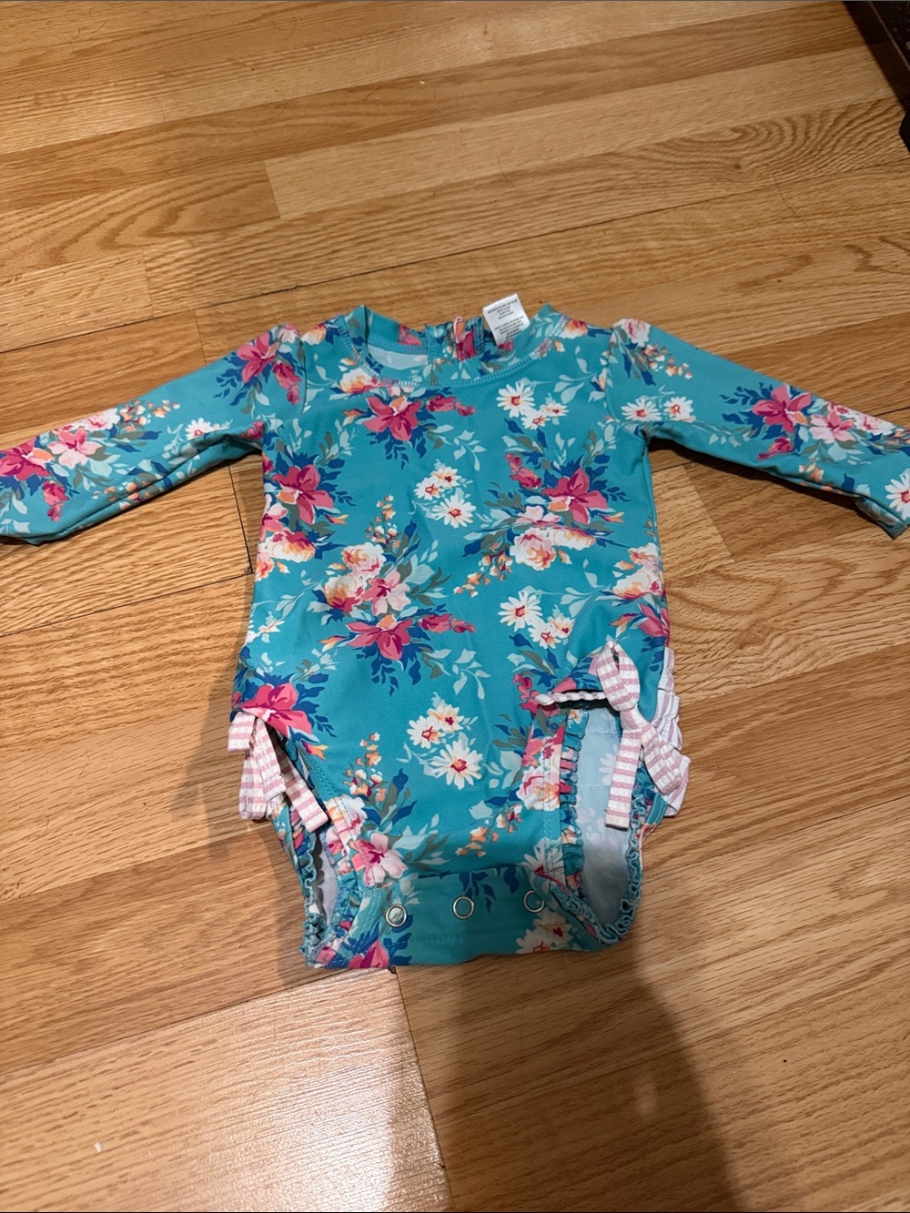 Ruffle Butts Turquoise Floral Long-Sleeve One-Piece Swimsuit with Pink Bows
